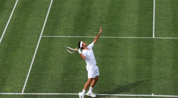 NEWPORT, RHODE ISLAND - AUGUST 28: Inductee Roger Federer of Switzerland serves while playing in the Celebrity Pro Classic match during the International Tennis Hall of Fame 2026 Induction Ceremony on August 28, 2026 in Newport, Rhode Island.  (Photo by Clive Brunskill/ITHF/Getty Images)